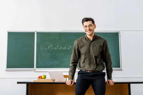 Placeholder image of a teacher in a classroom